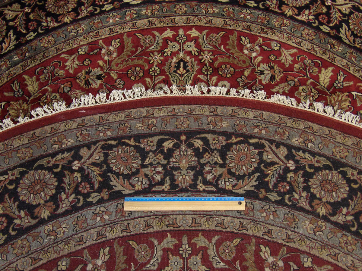 Black & Red Fine Persian Tabriz rug in room setting