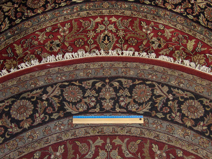 Black & Red Fine Persian Tabriz rug in room setting