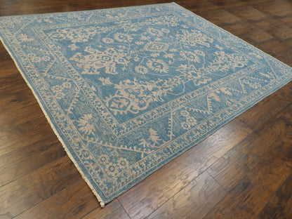 Blue and gray Oushak Chobie rug in a living room setting