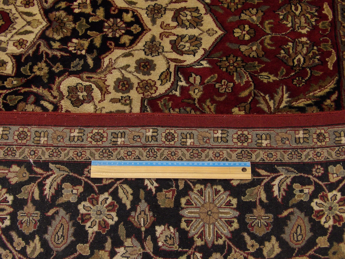 Black & Red Fine Persian Tabriz rug in room setting