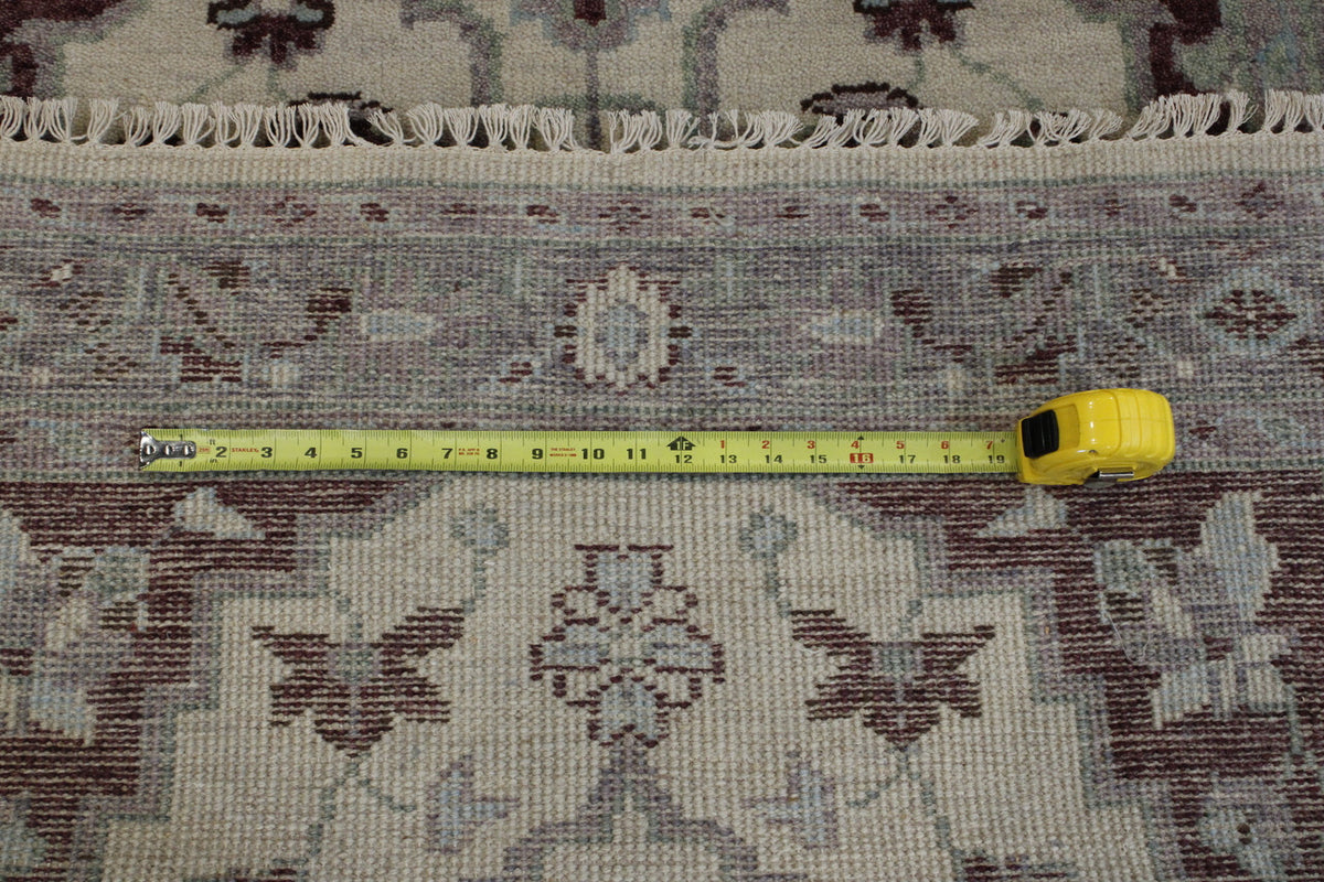 Beige Tribal Heriz Oushak rug in room setting
