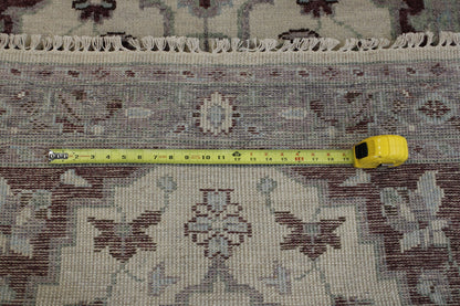 Beige Tribal Heriz Oushak rug in room setting