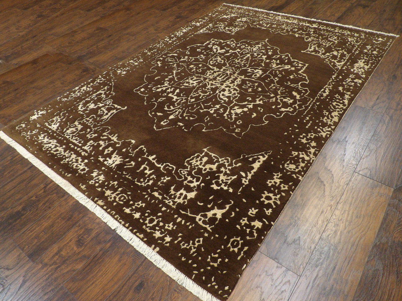 Broken Heriz abstract pattern detail, brown and gold rug
