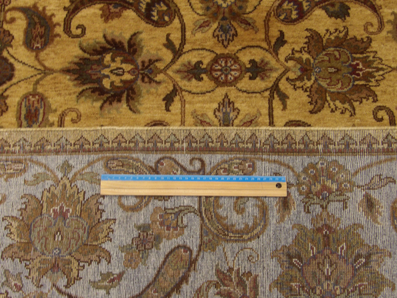 Gold and blue Ziegler rug in room setting