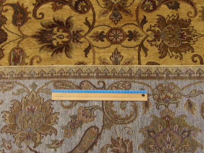 Gold and blue Ziegler rug in room setting