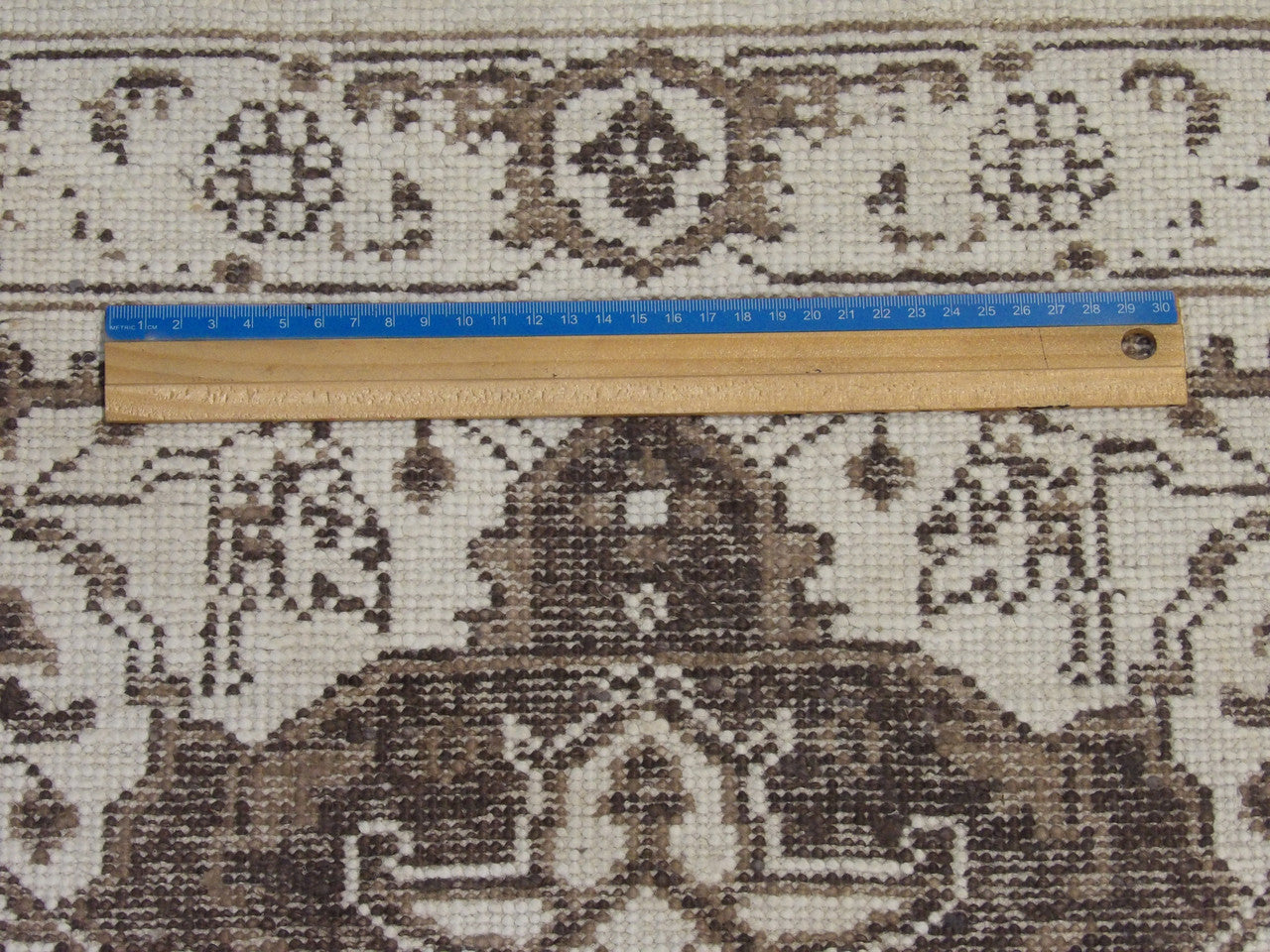 Brown & White Oushak rug in room setting