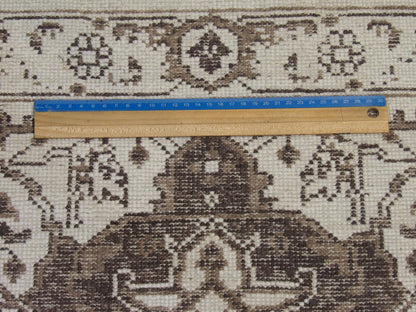 Brown & White Oushak rug in room setting
