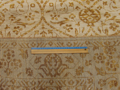 Brown and gold damask rug in room setting
