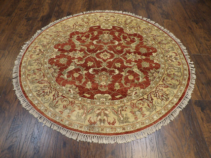 Close-up of wool pile, gold and rust round rug
