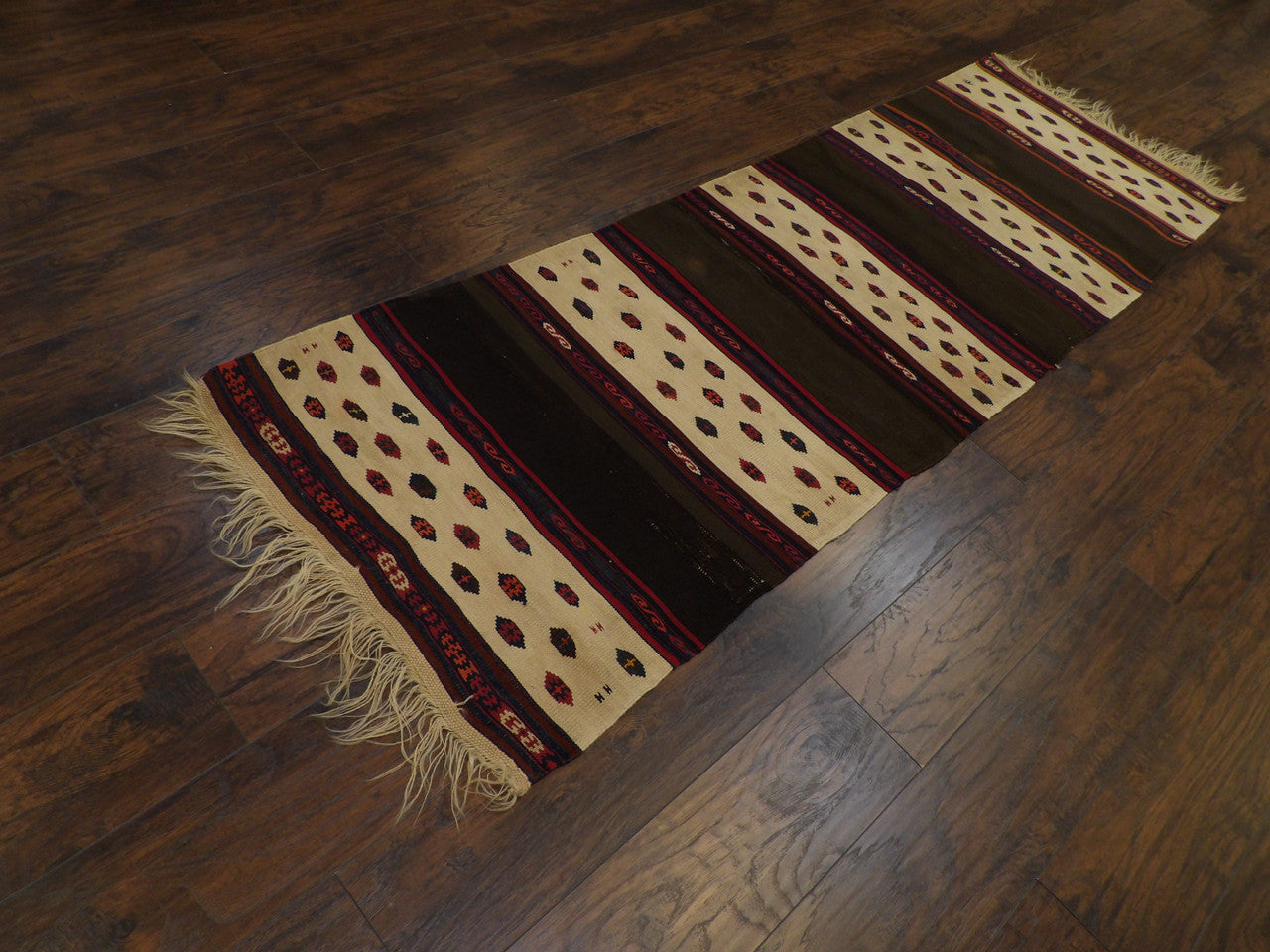 Antique kilim runner in a hallway setting