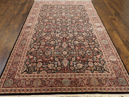 Close-up of wool-silk pile, black and red rug