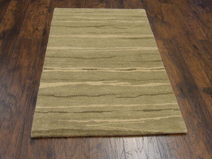Close-up of wool pile, green modern rug