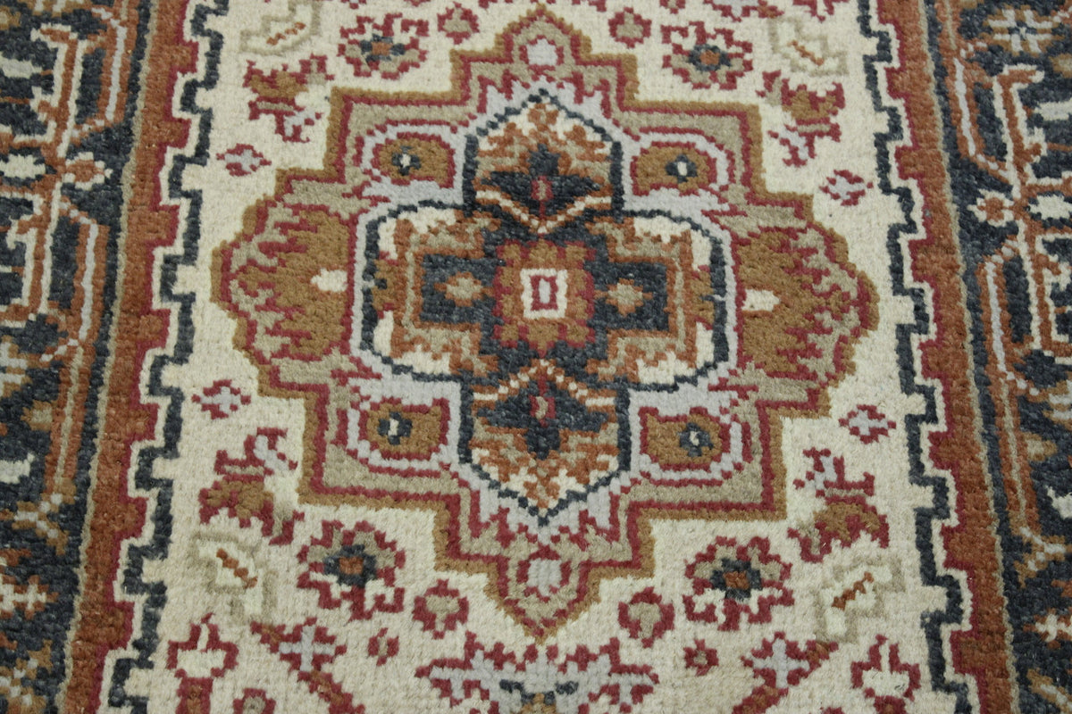 Tribal Heriz rug corner detail