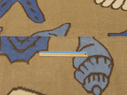 Blue and brown coastal rug in room setting