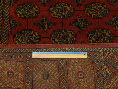 Gold and red Bokhara rug in room setting