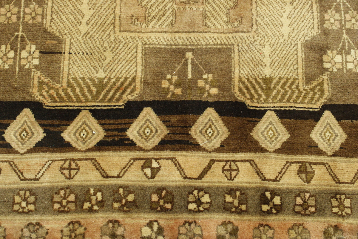 Brown & Pink Tribal Antique Hamadan rug in room setting