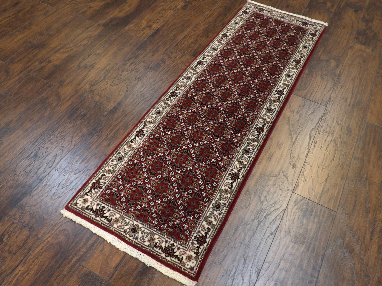 Close-up of wool pile, beige and red runner
