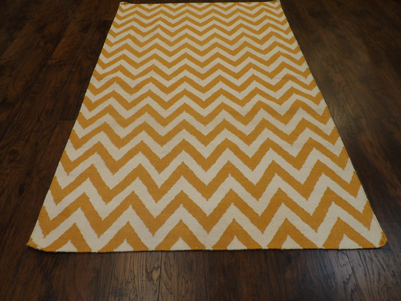 Back of hand-knotted coastal rug showing reversible weave