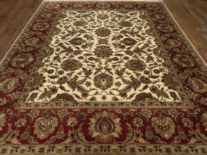 Close-up of wool pile, beige and red rug
