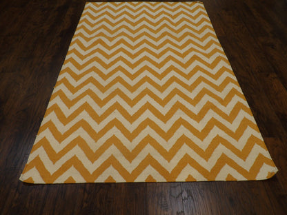 Close-up of flatweave texture, gold coastal rug