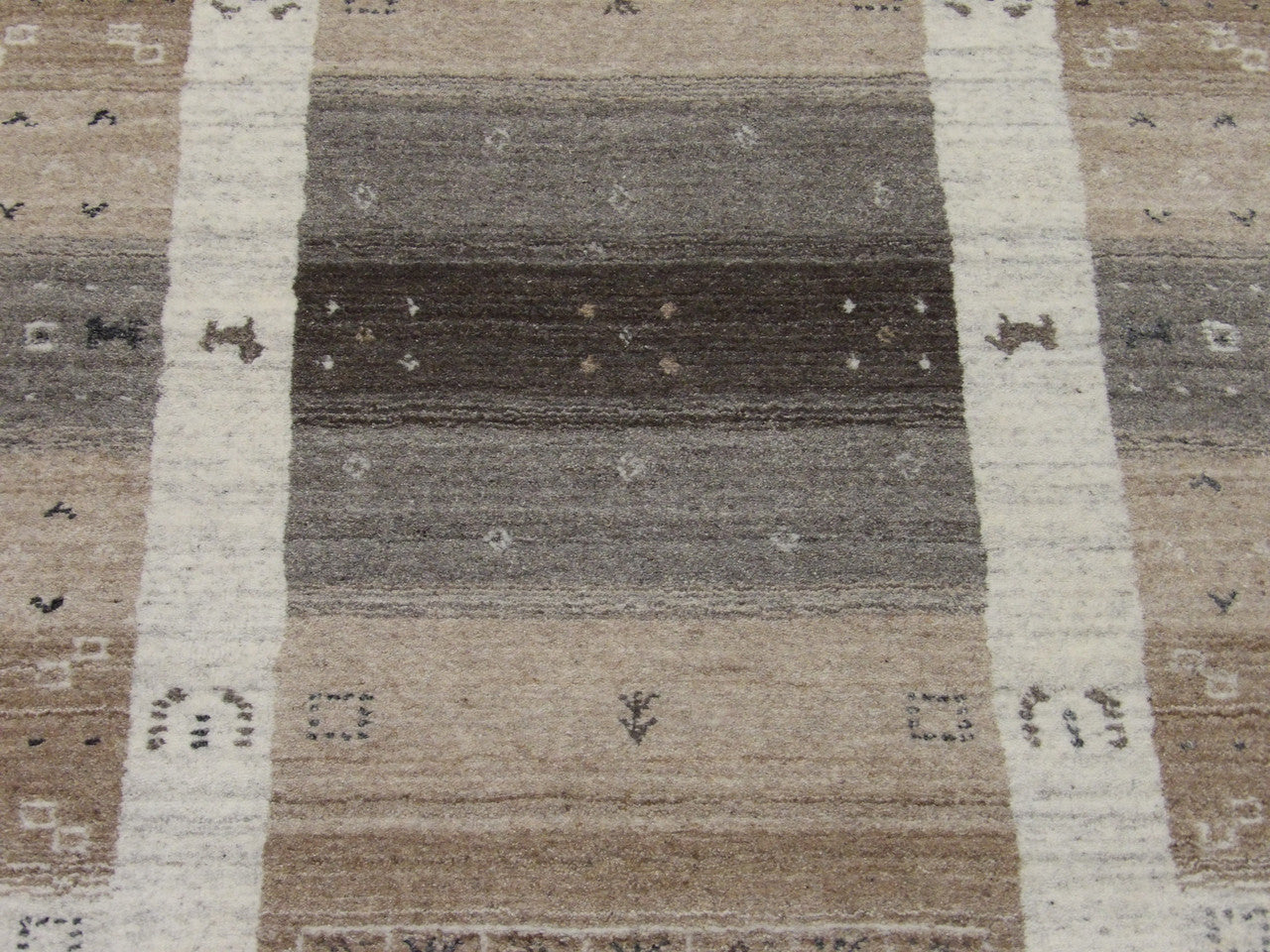 Gabbeh wool texture close-up, gray and white