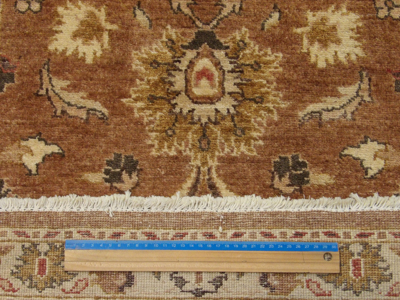Beige and rust Oushak runner in hallway setting