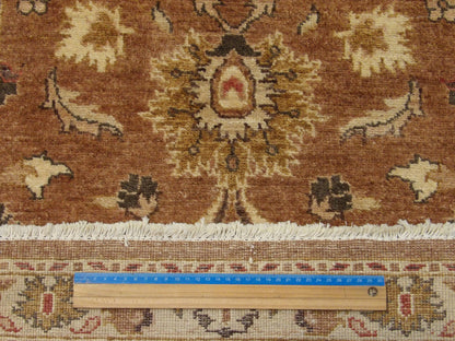 Beige and rust Oushak runner in hallway setting