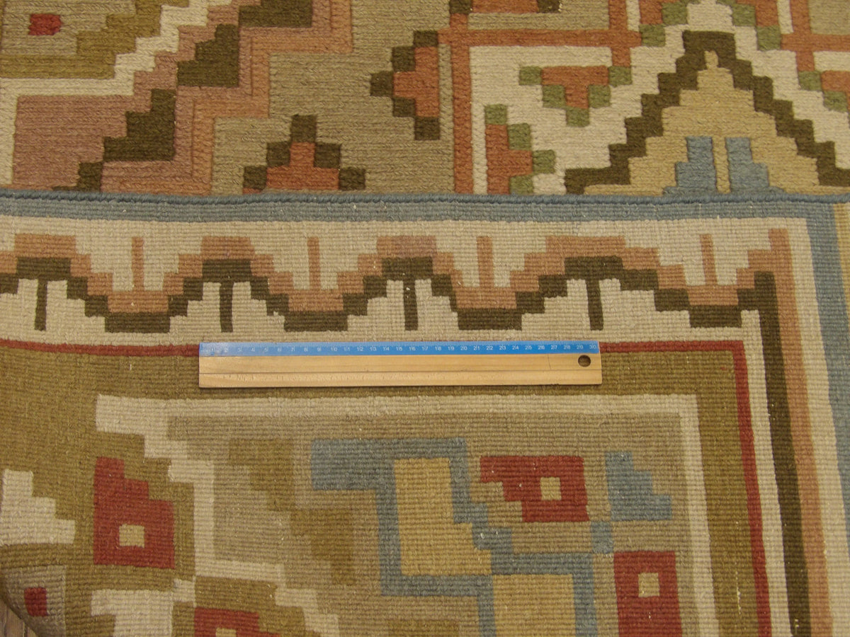 Green & Beige Tribal Soumak rug in room setting