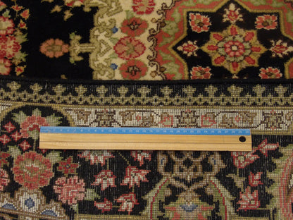 Black Fine Persian Qum rug in room setting