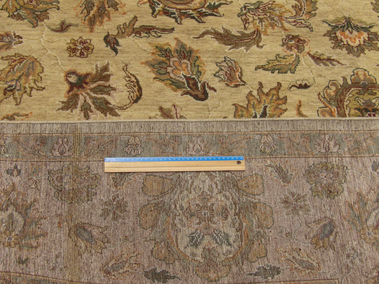 Gold and pink Kashan rug in room setting
