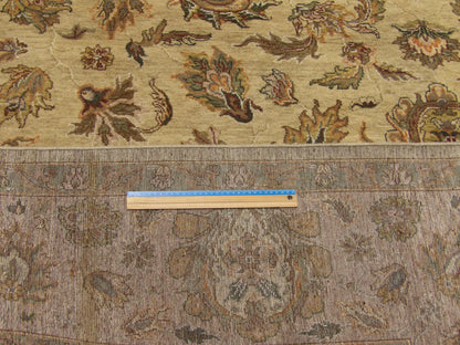 Gold and pink Kashan rug in room setting