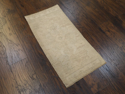 Antique beige Yastik rug in a small accent setting