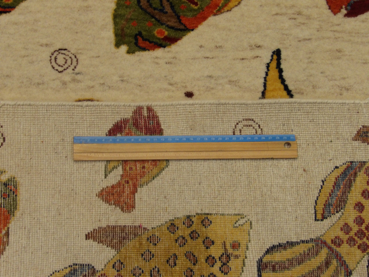 Beige & Multi-Color Natural Coastal Fish Design rug in room setting