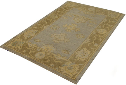Vintage Oushak pattern detail, faded grey and brown rug