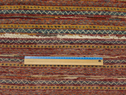 Tribal carved stripe runner in hallway setting