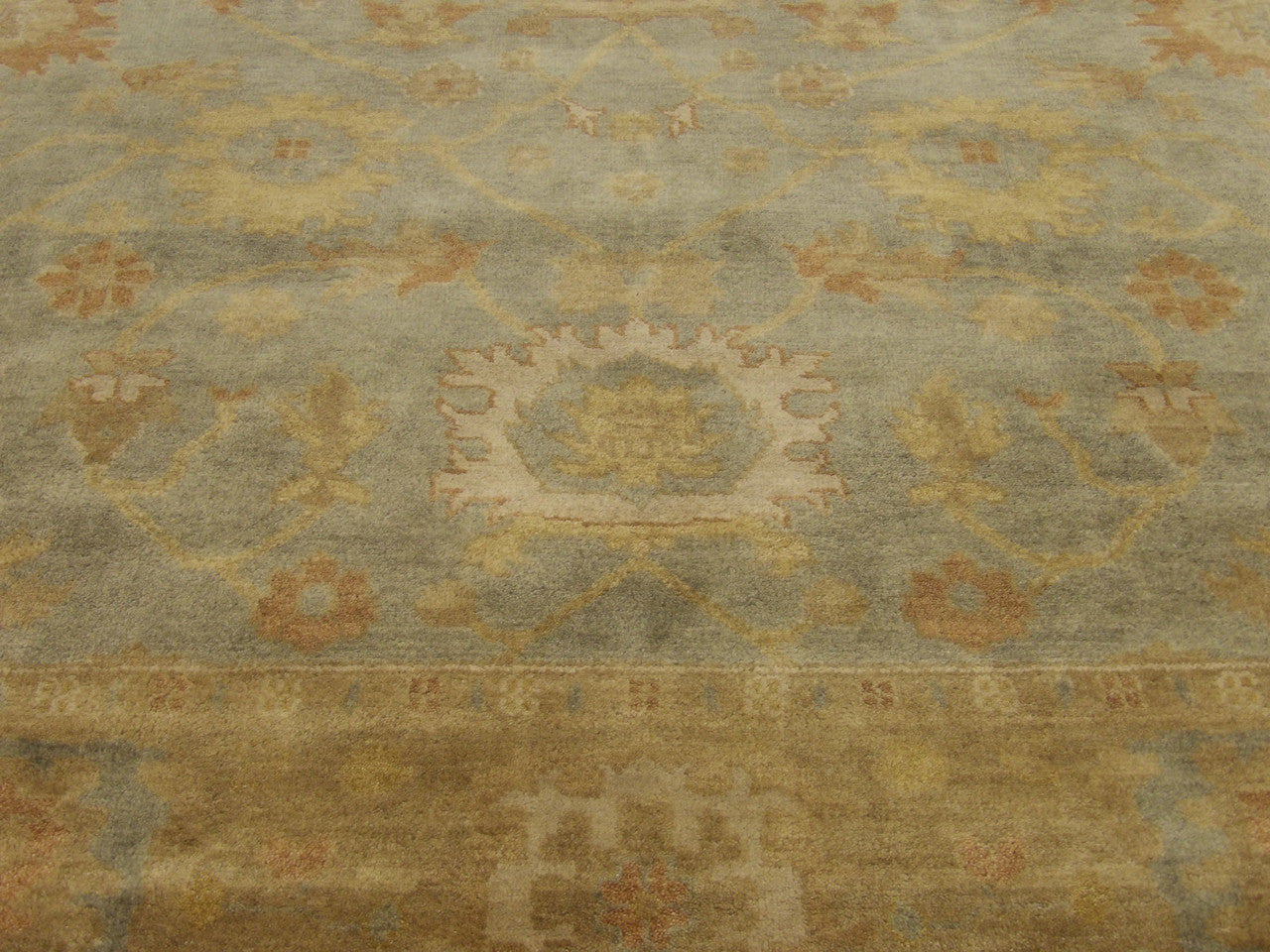 Oushak rug border detail, gold and green