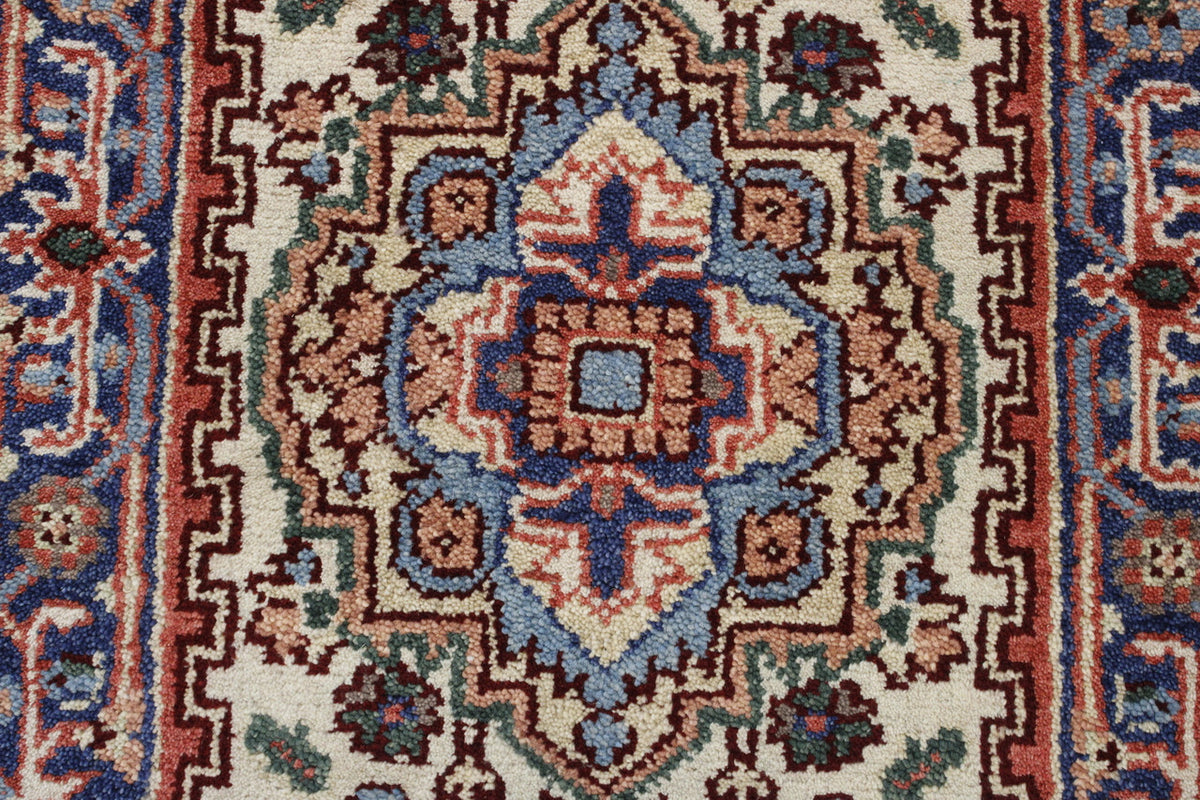 Tribal Heriz rug corner detail