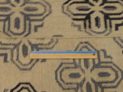 Full room view of gold coastal flat weave hand-knotted rug