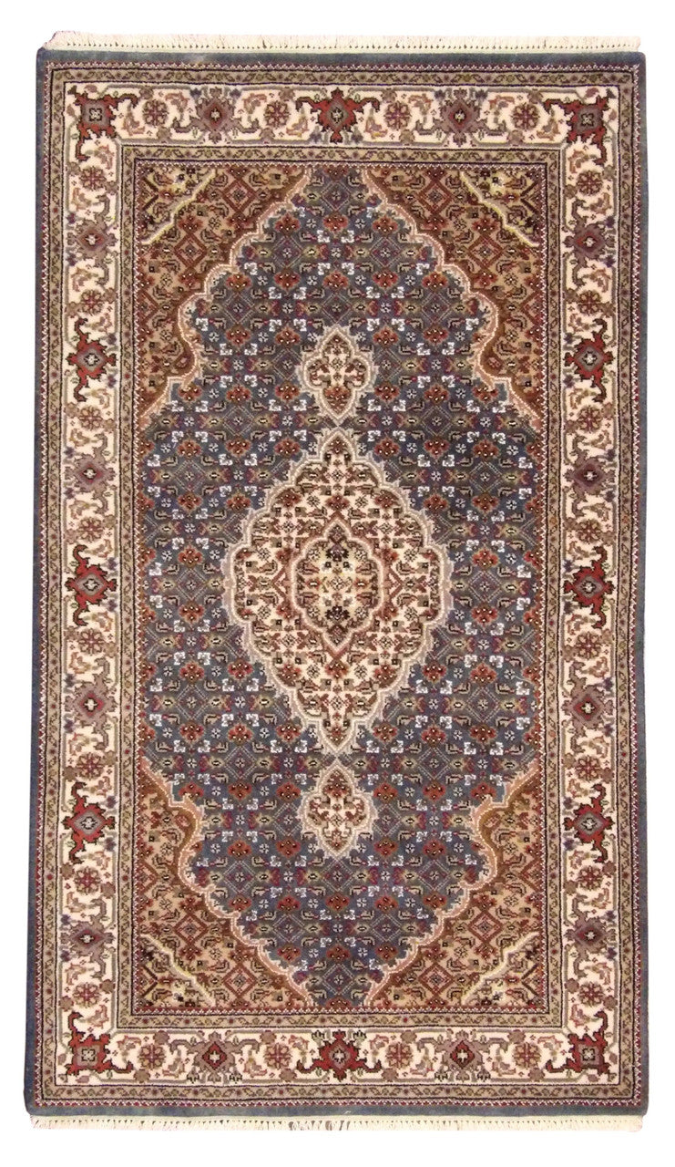 Tabriz hand-knotted wool rug in beige and teal, full view