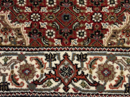 Fine Persian Tabriz rug border detail