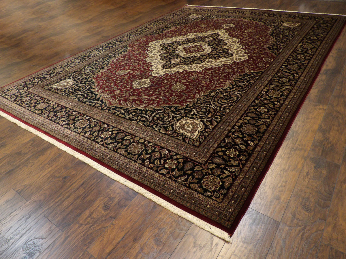 Black & Red Fine Persian Tabriz rug in room setting