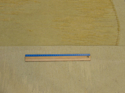 Gold Tibetan rug in room setting