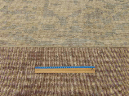 Blue and gold Oushak rug in room setting