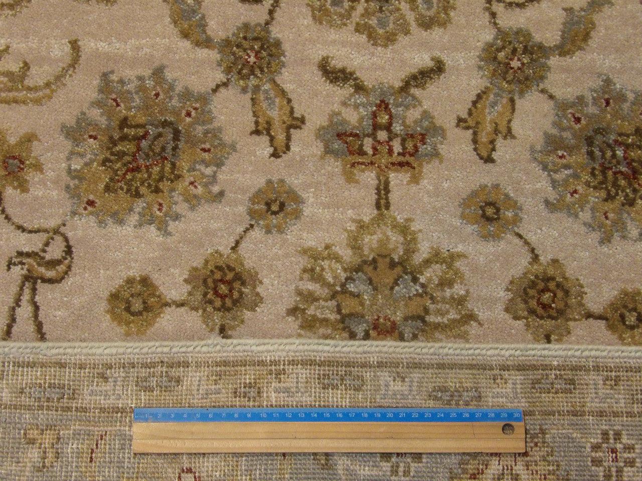 Blue and ivory Chobi rug in room setting