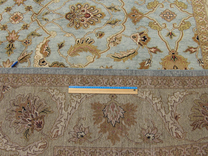 Blue and gold Kashan rug in room setting