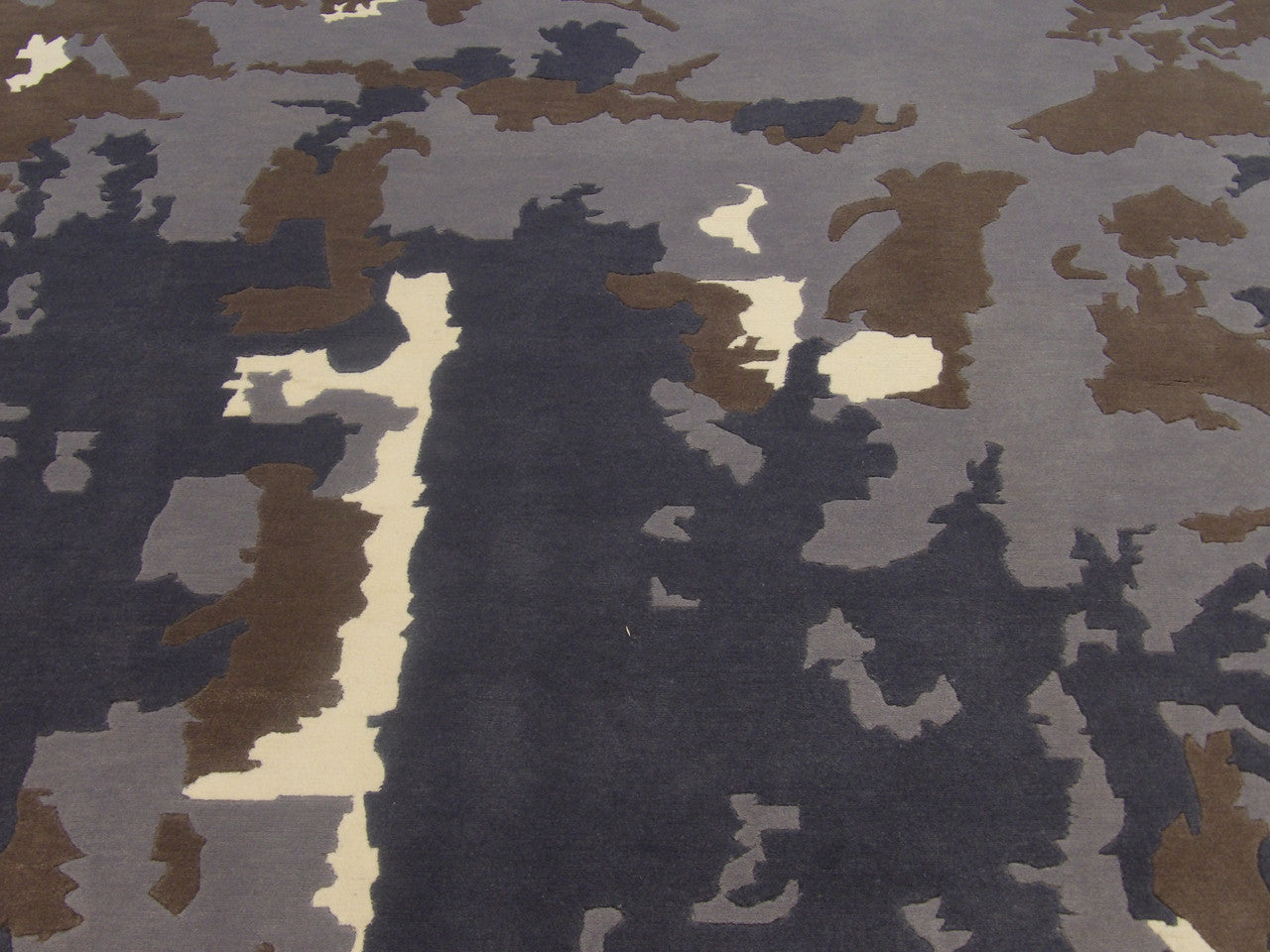 Abstract marble rug edge detail, blue and white