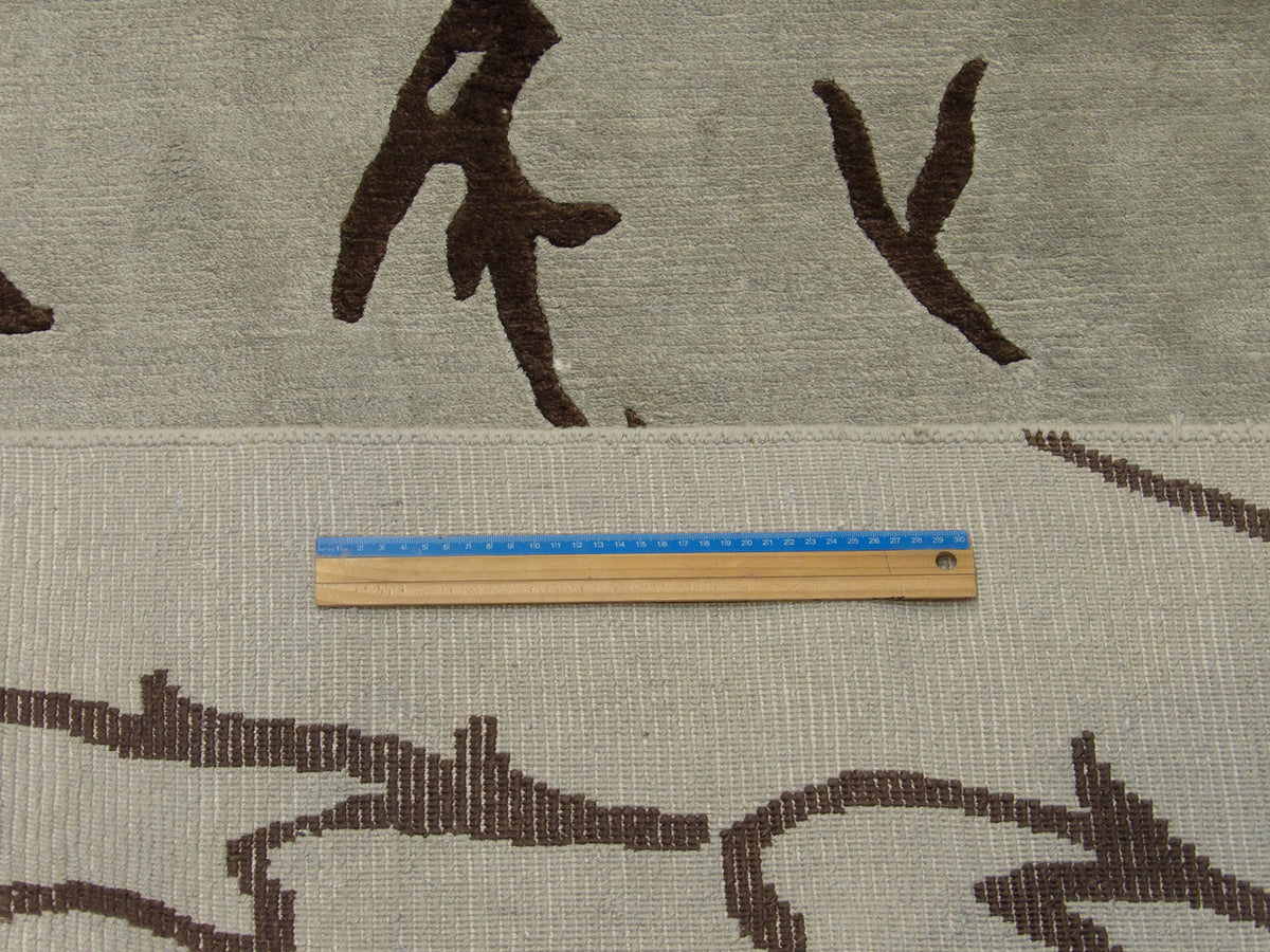 Blue and brown leaves rug in room setting
