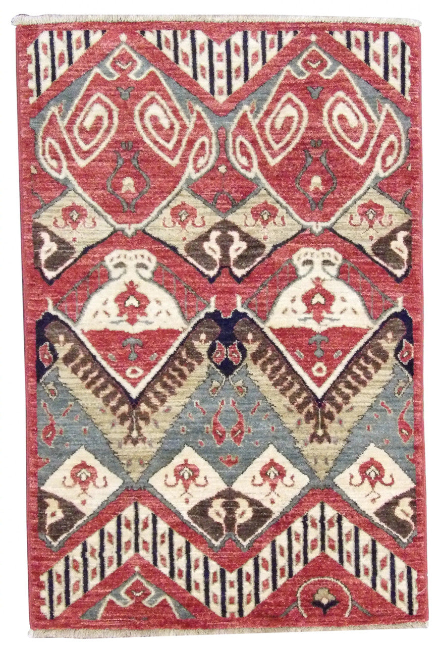 Ikat hand-knotted wool rug in red, full view