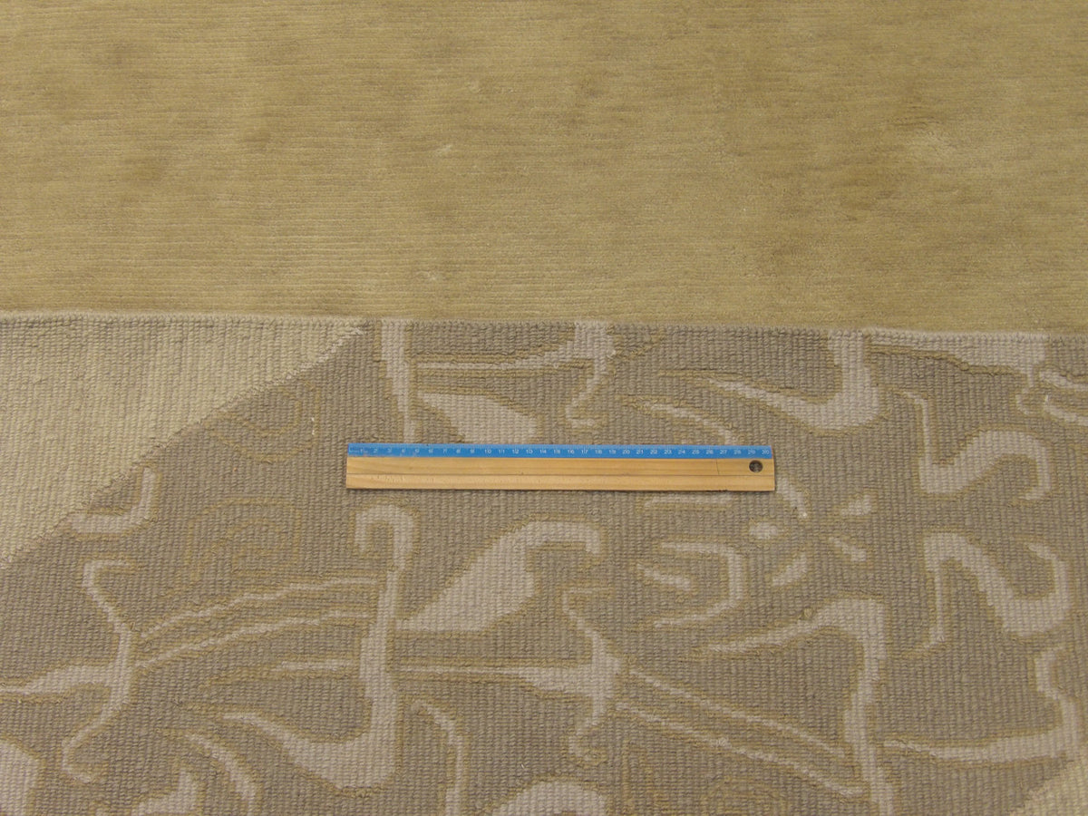 Brown and beige curve rug in room setting