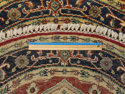 Blue and red Heriz round rug in room setting